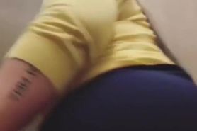 Who is this milf big butt Latina showing her ass up skirt in the office bathroom?