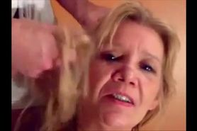 Blonde granny is taking a cumshot on her eyes