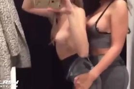 Two hot girls having lesbian sex in changing room