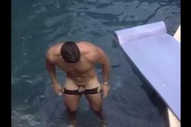 American bodybuilder Darren Fernandez showing off his small dick in a pool
