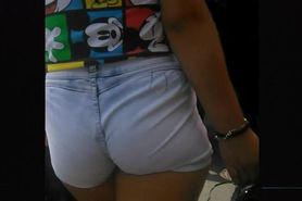Following real candid ass teen in tight shorts