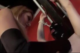 Beautiful blonde mistress tortures slave chained to a rack