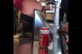 Serving beer with her ass