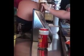 Serving beer with her ass
