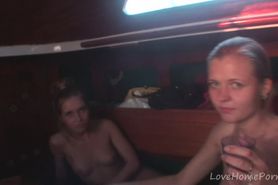 Beautiful girls eat each other on a boat