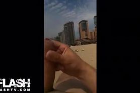 Cumming behind a girl on beach