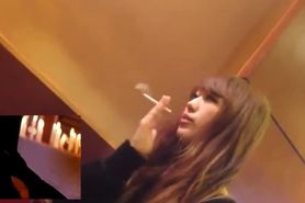 Japanese woman smoking while man gets public erection under the table