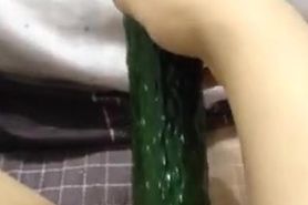 Taiwanese girl masturbating with cucumber