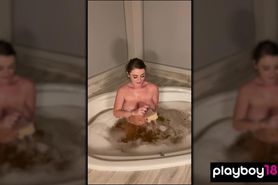 Chubby MILF Sophie Dee fingering her shaved pussy in the bath