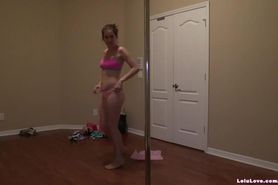 Amateur girl poledancing while she changes in and out of outfits