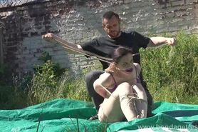 Outdoor bondage and cloth gagging of dominated submissive Caroline Pierce