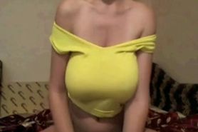 Brunette plays with her big natural tits