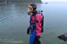 Sexy scuba girl in viking drysuits and mask