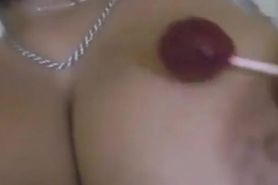 Teen with huge boobs sucking a lolipop and flashing
