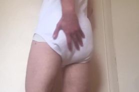 Abdl boy messes his soaked nighttime diaper in his onesie
