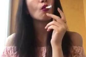 Beautiful brunette girl smoking sexy