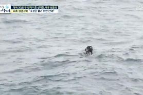 Korean diver milf in hooded wetsuit