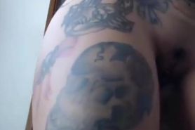 fake-breasted tattooed latin cam-slut