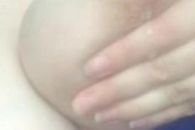 Lactating milf sucking own boobs