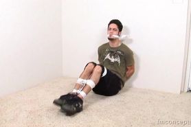 Luke is tied up and gagged on the floor