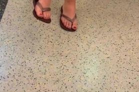 Hot woman sexy legs and red toes on train