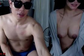 Busty Asian camgirl has fun with friend