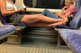 Sexy blonde legs and feet on train