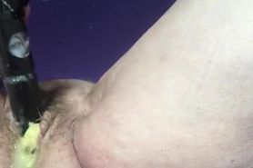 Granny puts banana all the way in her hairy pussy