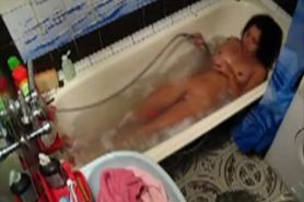 Hot latina teen fingering in the tub on hidden cam