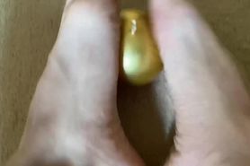 Horney boy found golden x-mas tree toy and is making a footjob for it