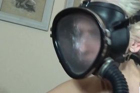Lesbians in latex screw with gasmask dildo