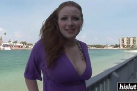 Redhead girl strips down on the beach