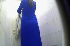 Peeping pissing women in the public toilet