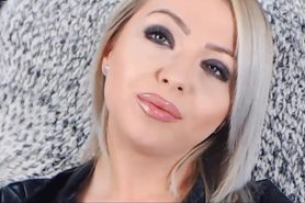 blonde mistress glossy lips tease and smoking in leather (face close up)