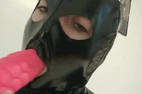 Sucking bad dragon with latex mask on