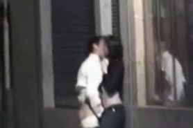 Drunk couple fooling around on the street