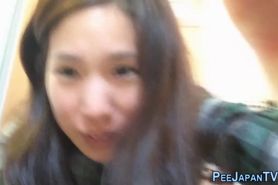 Asian teen pissing cup