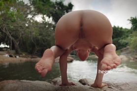 Redhead practicing yoga in nature
