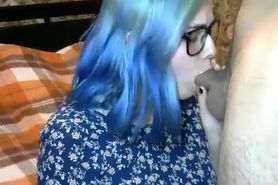 Sexy young blue haired girl giving smokey blowjob