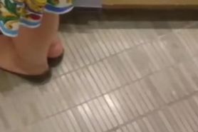 Sexy asian girl shoeplay at bookstore