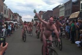 public naked bike riding male and female