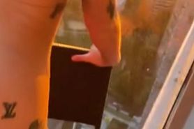Blonde escort gets fucked on a balcony and deepthroats a huge dick