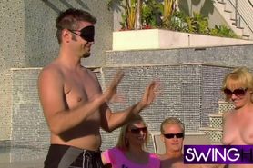 Swingers are playing blindfolded sex games naked in the pool
