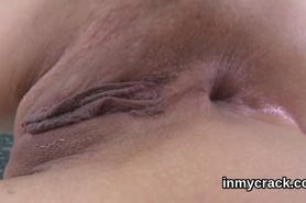 Ravishing sex kitten is exposing her stretched pink pussy in closeup