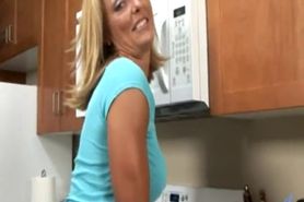 Busty Anilos Brenda James rides a dong on kitchen floor.