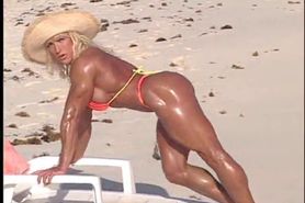 Erotic muscle MILF Peggy bares her vascular hard body at the beach