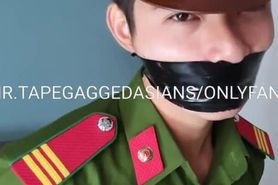 Vietnam police slave in uniform bound and tape gagged