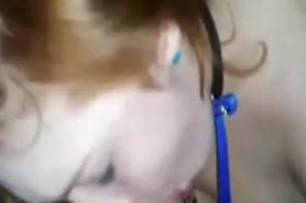 Collared and leashed redhead worships cock and balls