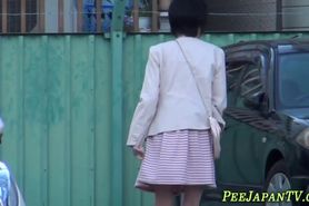 Fetish asian whore peeing in alleyway