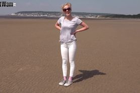 Girl in White Jeans Rolling in the Mud at Beach